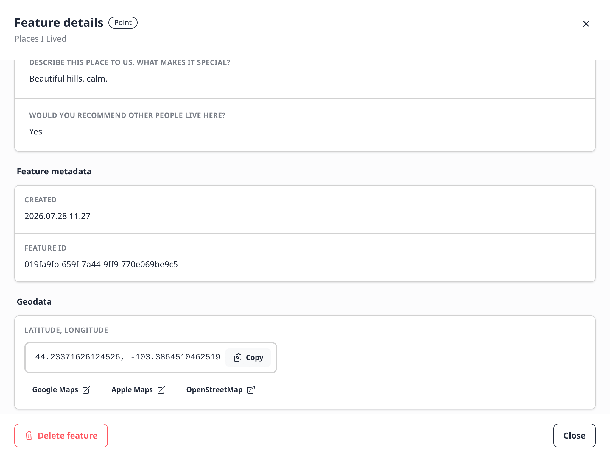 Feature details showing submitted answers, metadata, coordinates, map links, and the delete action